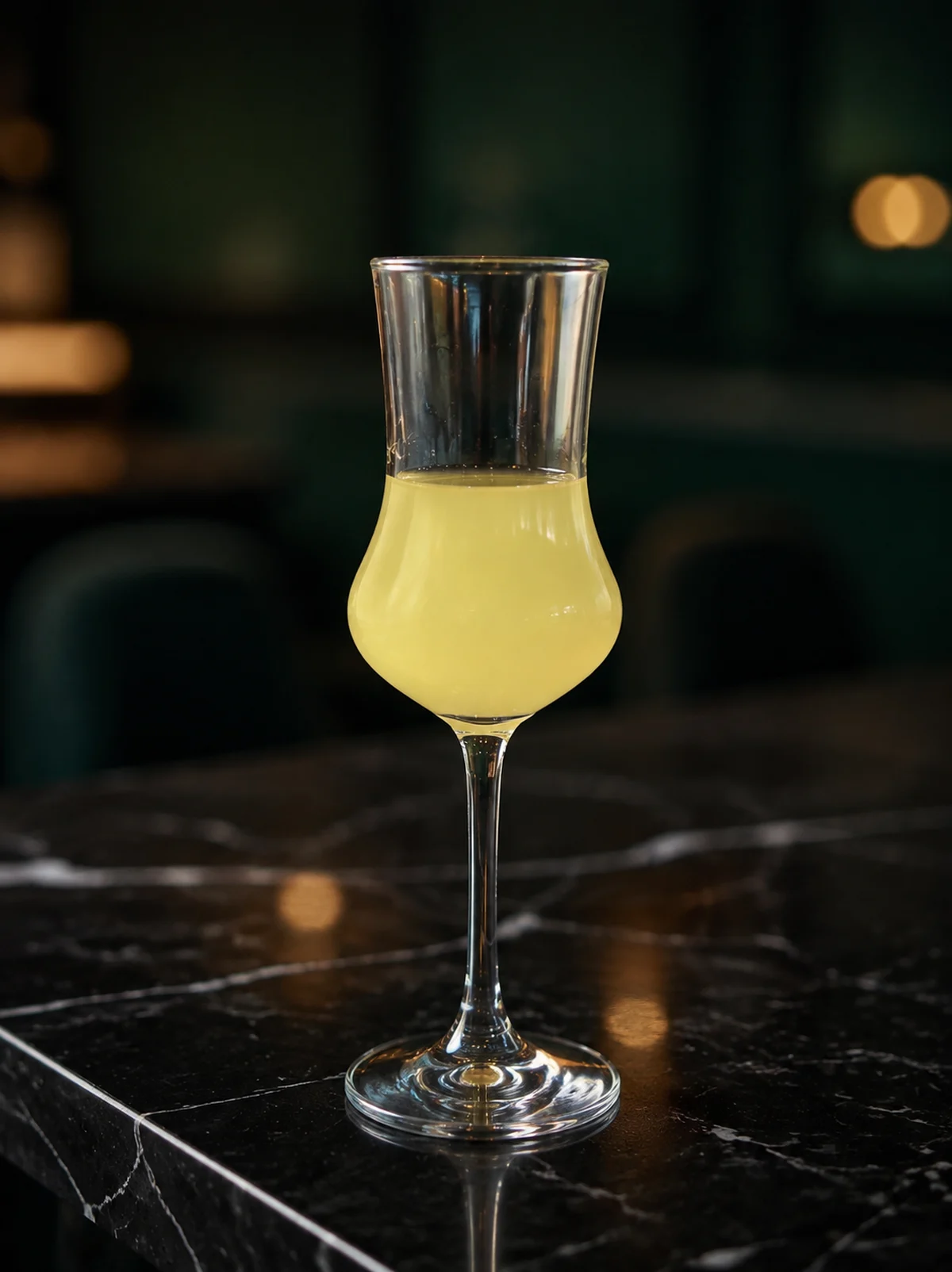 House-made limoncello served in Moderna's signature stemmed glass on the Marble Bar.