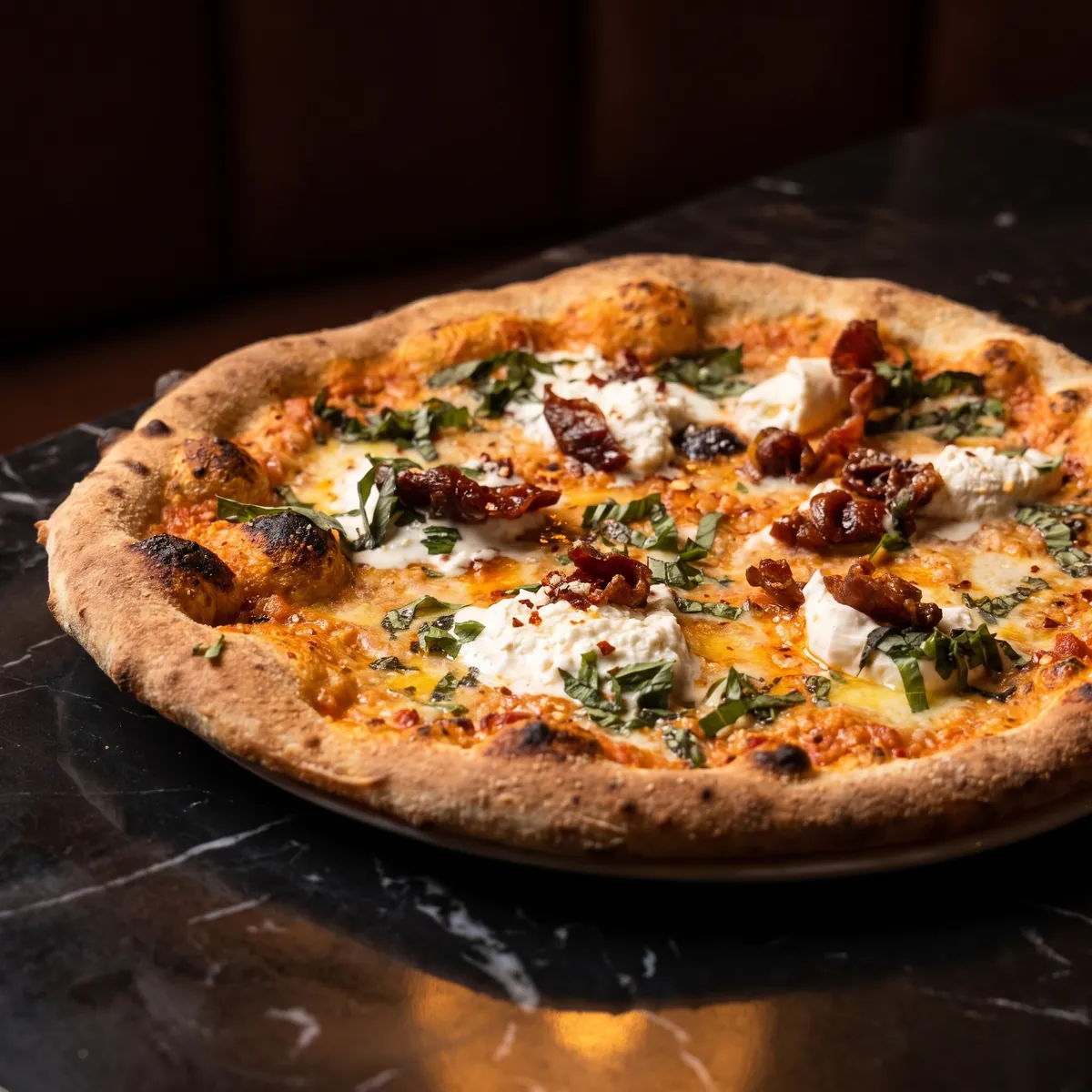 Vodka & Burrata pizza with vodka sauce, stracciatella, and crispy prosciutto